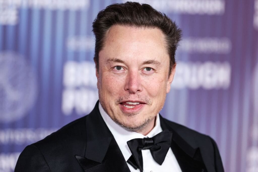 Elon musk looking at the camera.