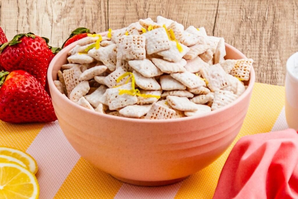 Strawberry lemonade chex mix in pink bowl. 