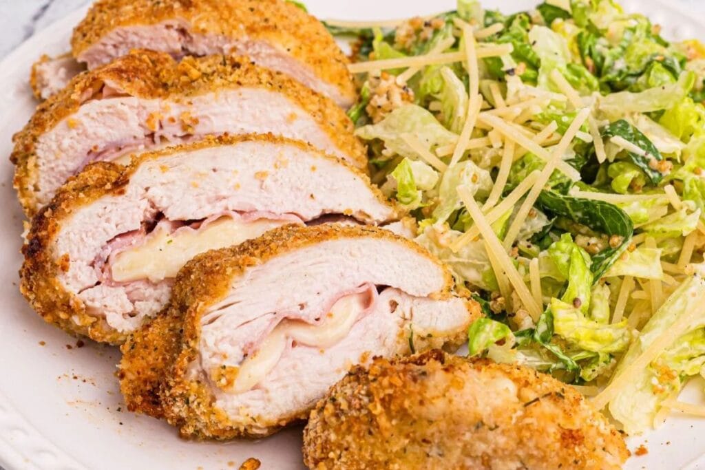 Sliced cordon bleu on a plate.