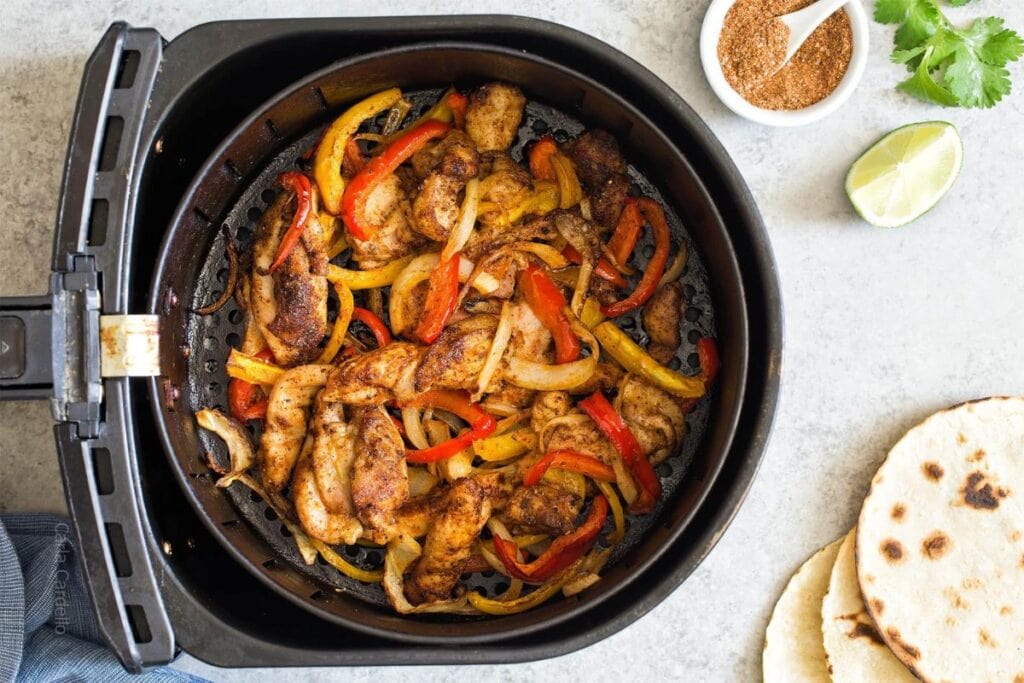 Chicken fajitas in an air fryer.