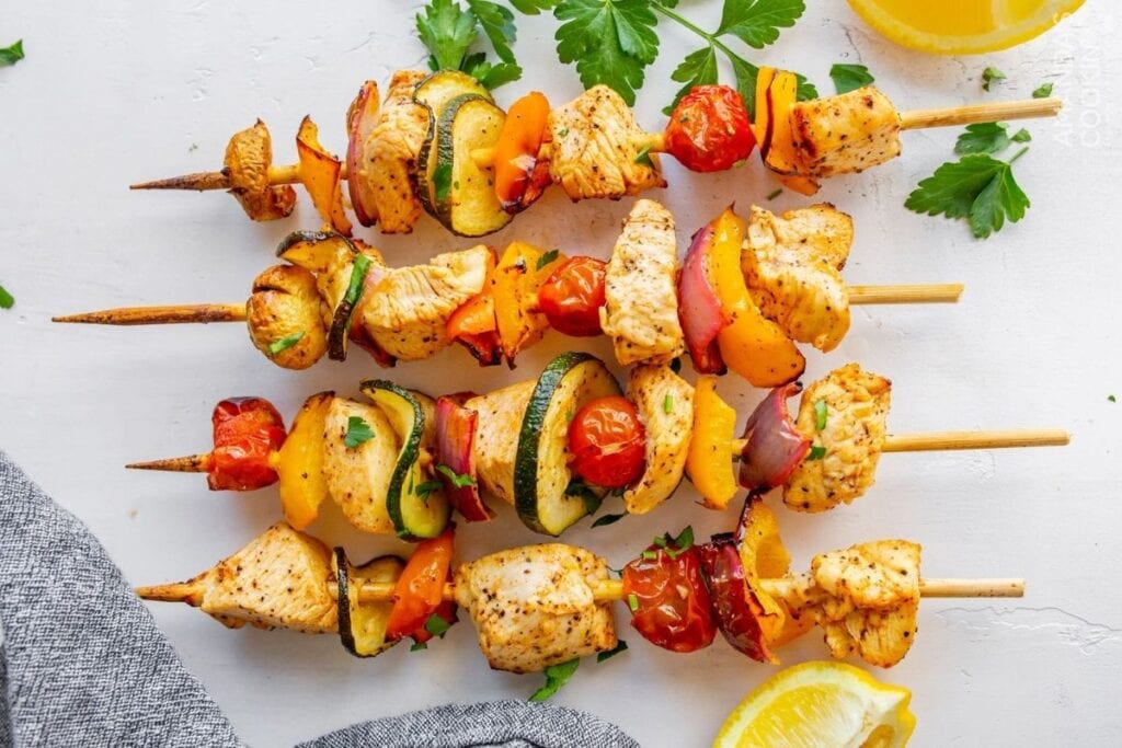 Chicken kabobs on a plate.
