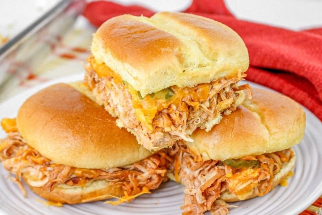 Chicken sliders on a plate.