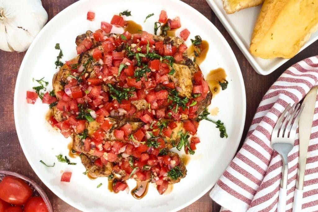 Bruschetta chicken on a plate.