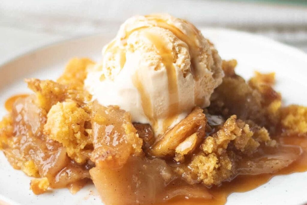 Apple cobbler with a scoop of ice cream.