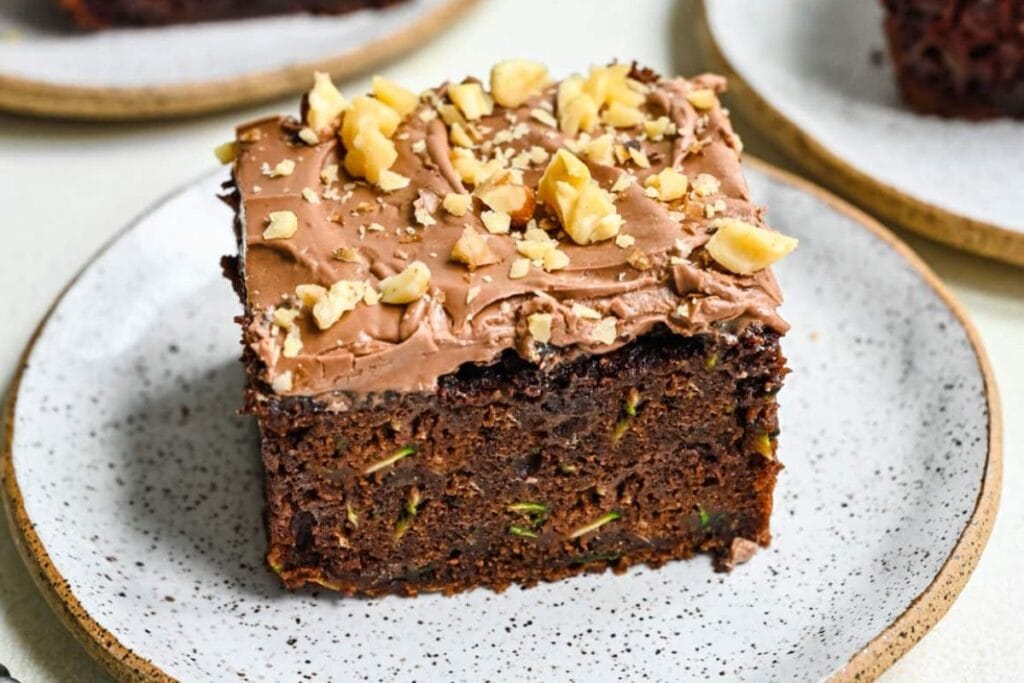 A slice of chocolate zucchini cake on a plate.