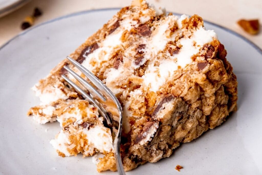 A slice of cookie cake on a plate.