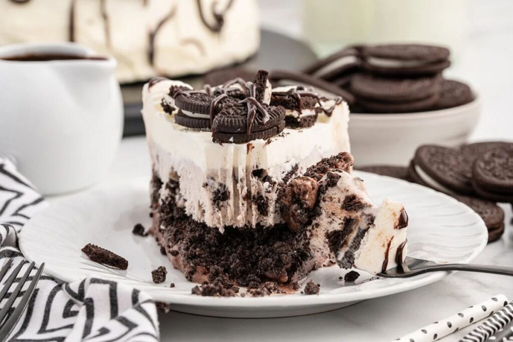 A slice of Oreo cookie ice cream on a plate.