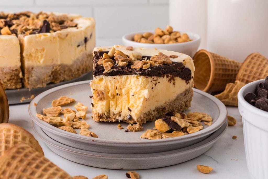 Drumstick pie with a bite on a plate.