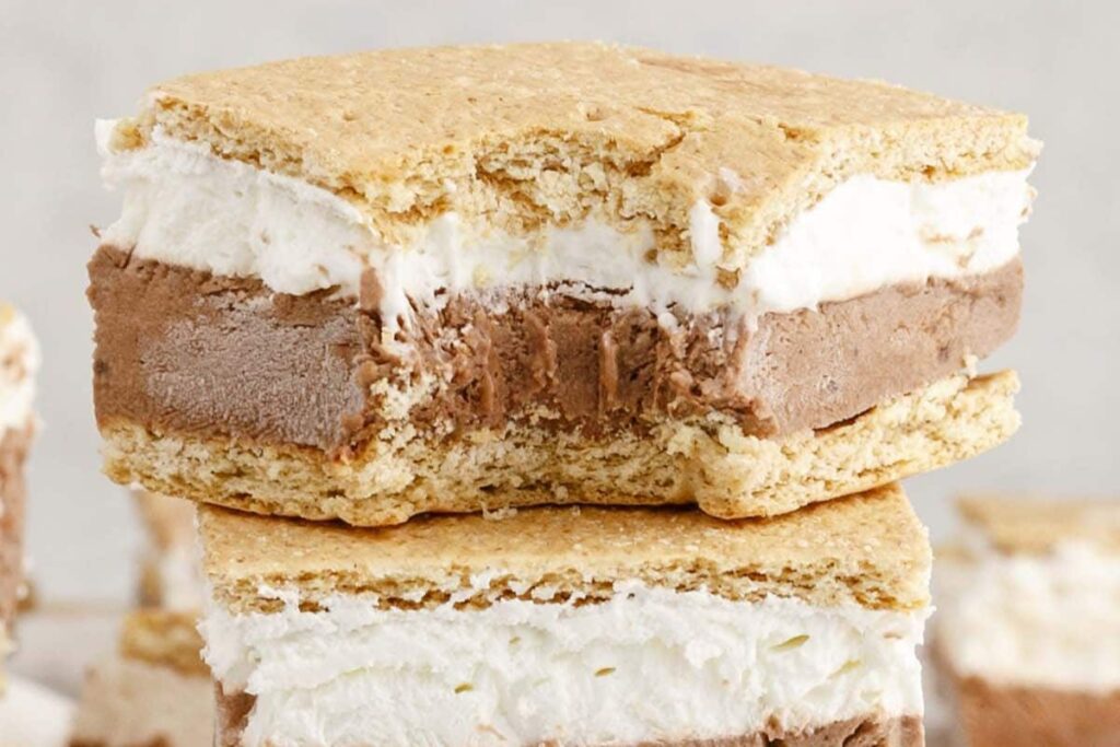 A slice of frozen s'mores with a bite.