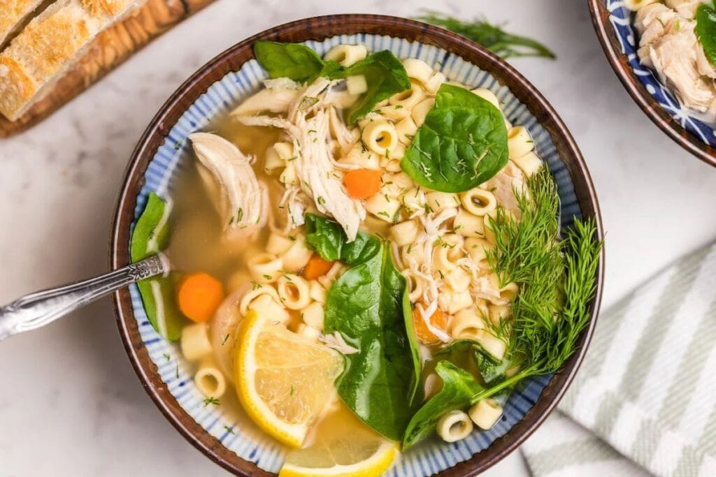 Lemon and chicken soup in a bowl.