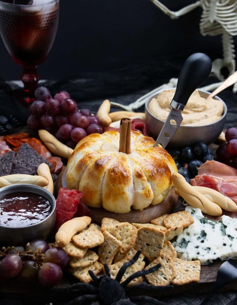 Halloween charcuterie with melting cheese.