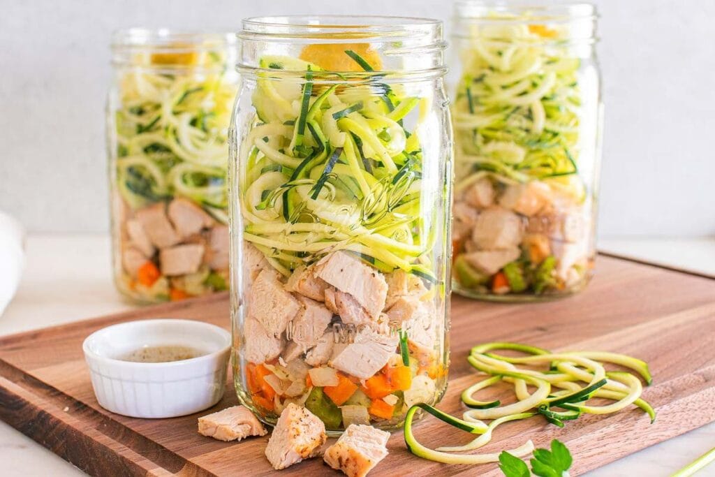 Three jars of chicken zoodle soup.