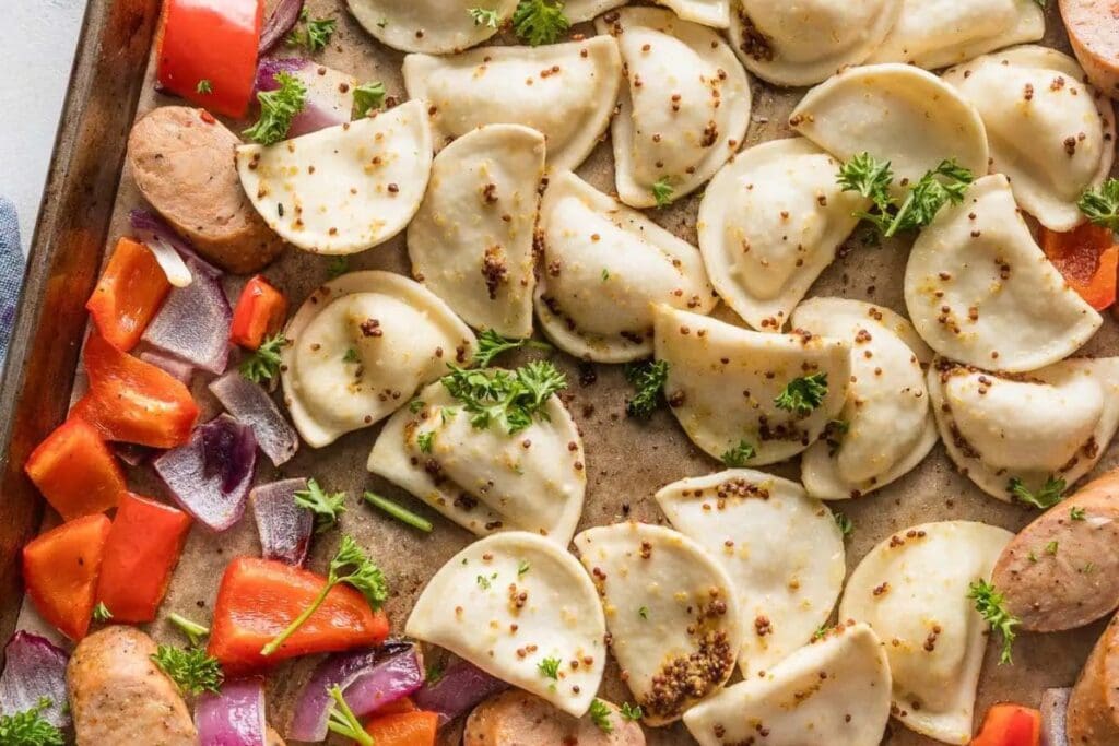 Mini pierogies on a sheet pan.