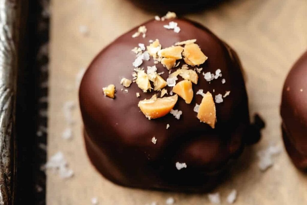 Oreo truffles with peanuts on top.