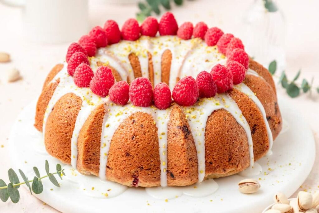 Bundt cake with berries on top.