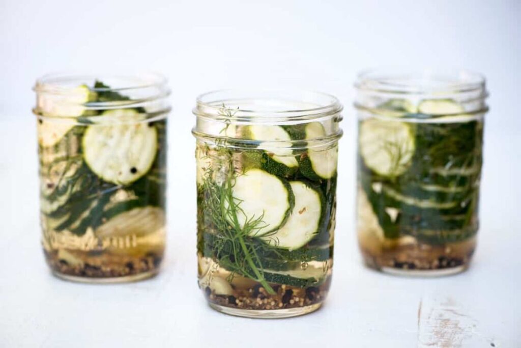 Three jars of zucchini pickles.