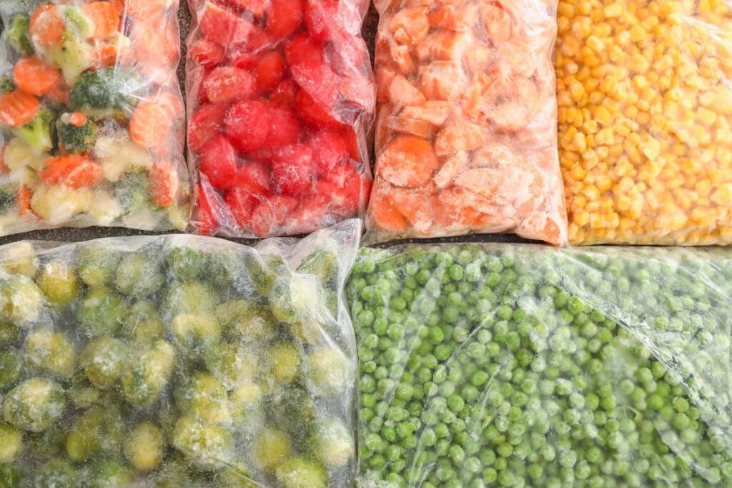 Frozen veggies in plastic bags.