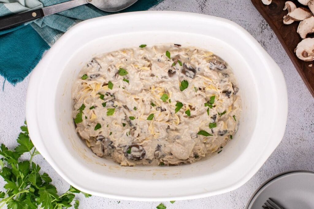 Chicken stroganoff in a white dish.