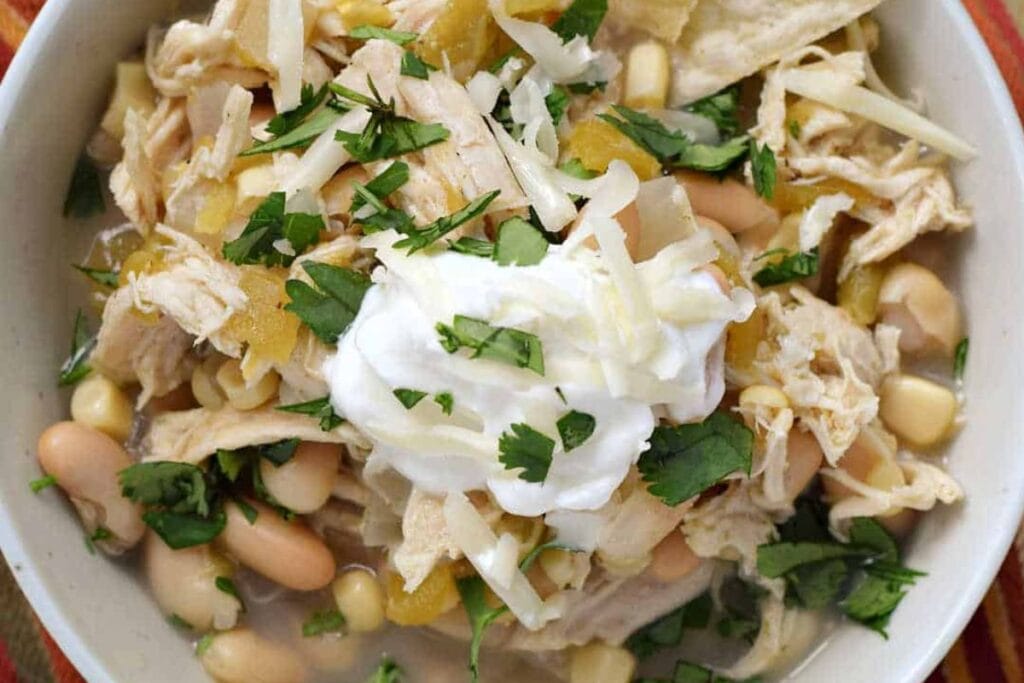 Close up shot of chicken chili in a bowl.