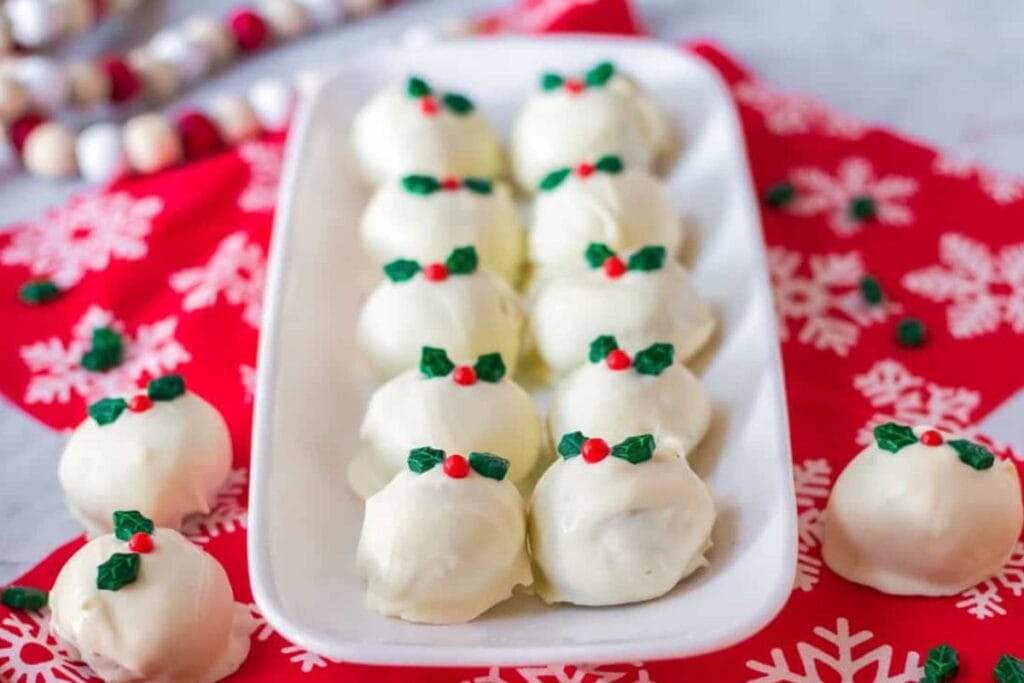 Snickerdoodle truffle son a white plate.