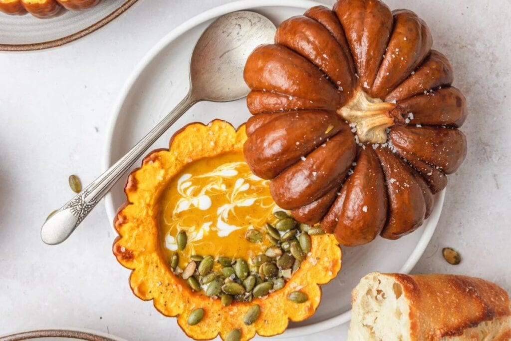 Pumpkin with soup in inside.