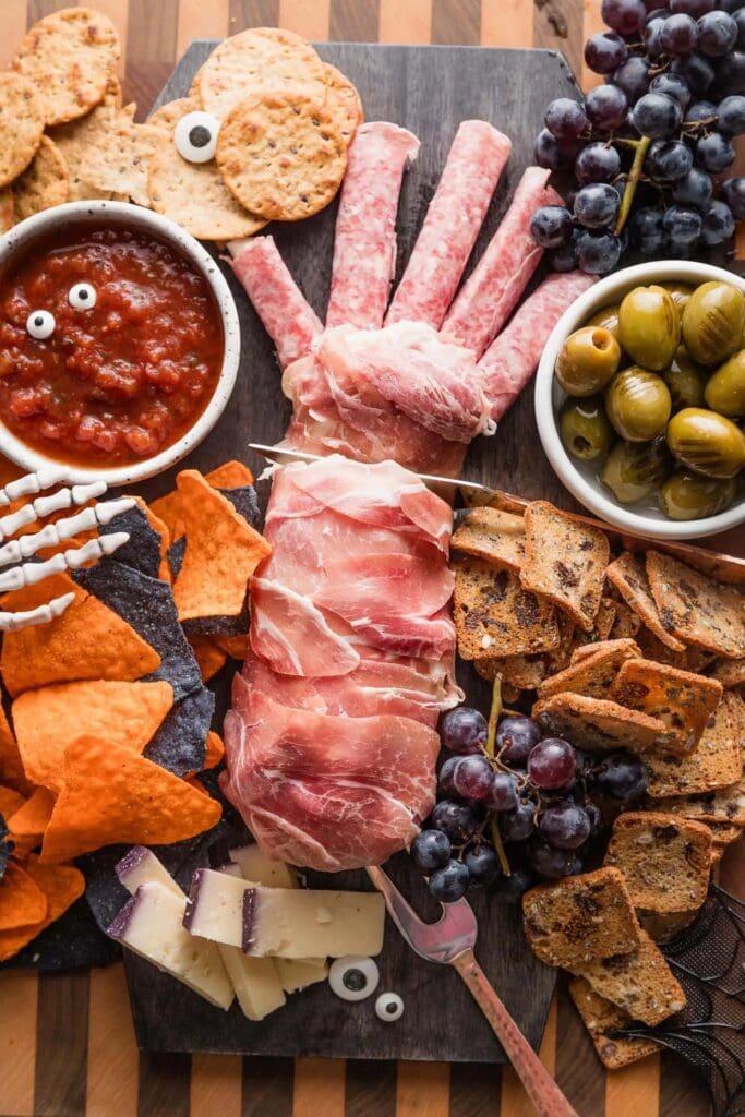 Halloween cheese board with a hand formed prosciutto.