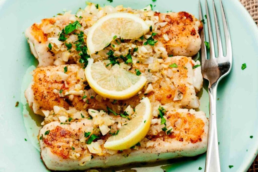 Fish with sliced lemons.