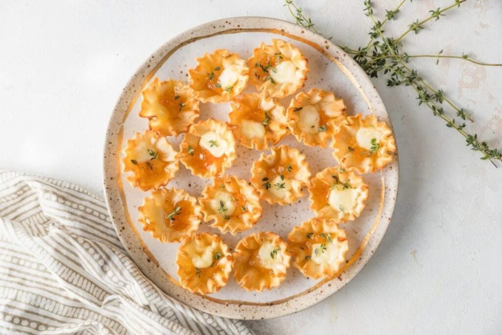 Baked Apricot Brie Bites served on a white plate.