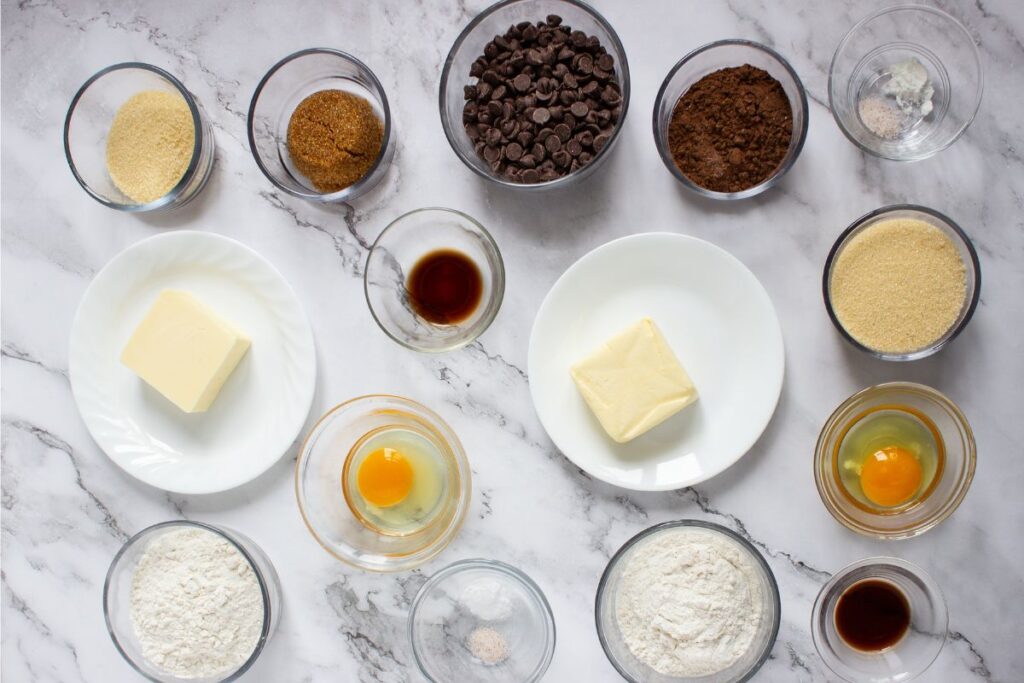 Ingredients for brookies cookies on a marble counter.