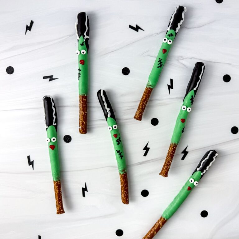Bride of Frankenstein pretzel rods on marble counter.