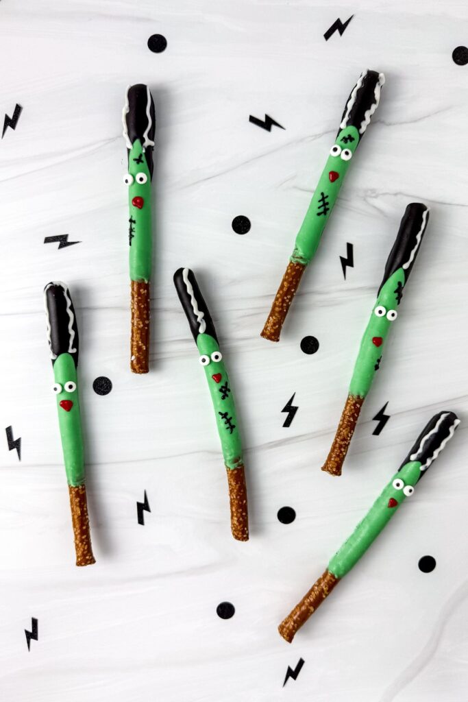 Bride of Frankenstein pretzel rods on marble counter.