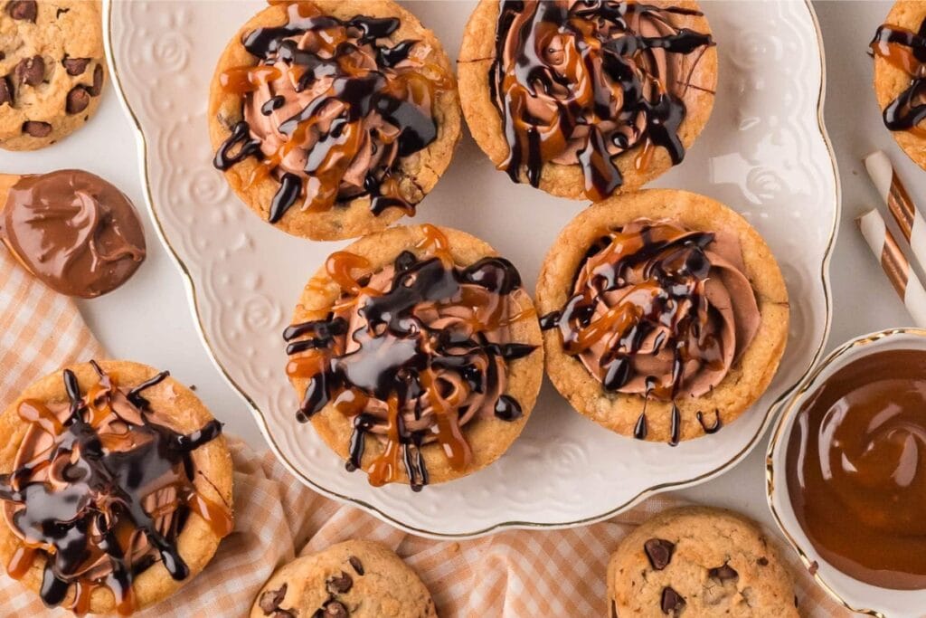 Cheesecake cookie cups on a white plate.
