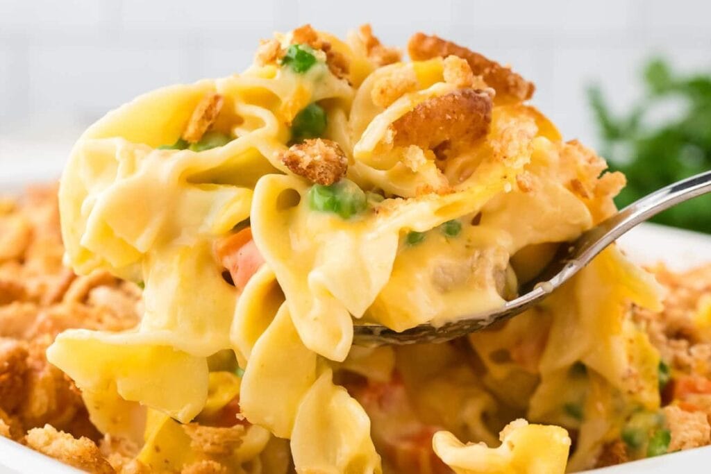 Chicken and noodle casserole in a white bowl.