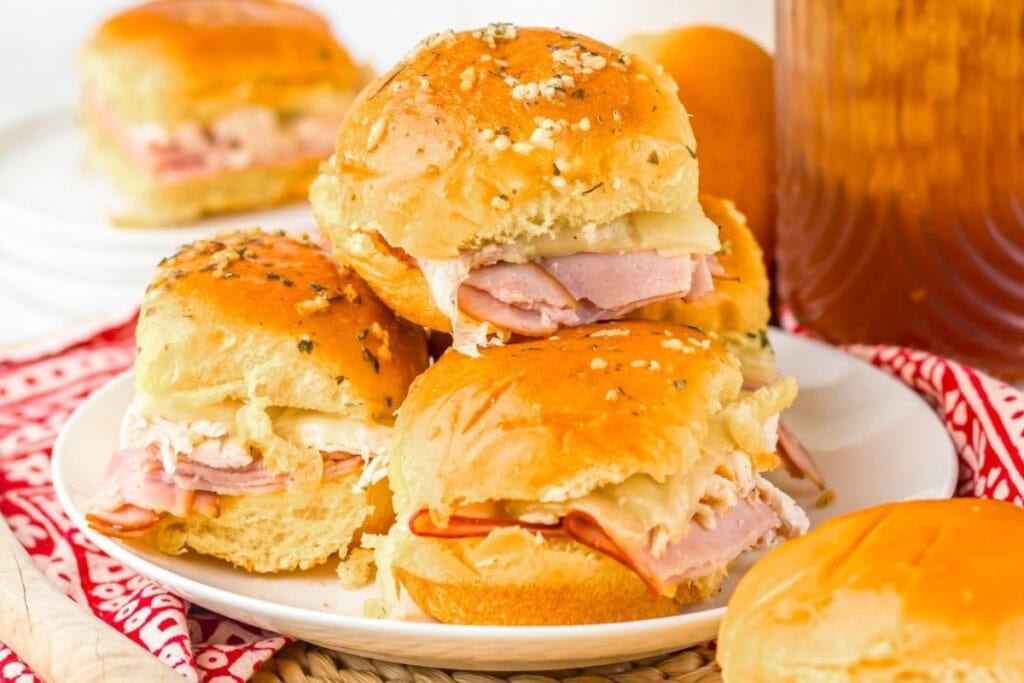Chicken cordon bleu sliders on a plate.