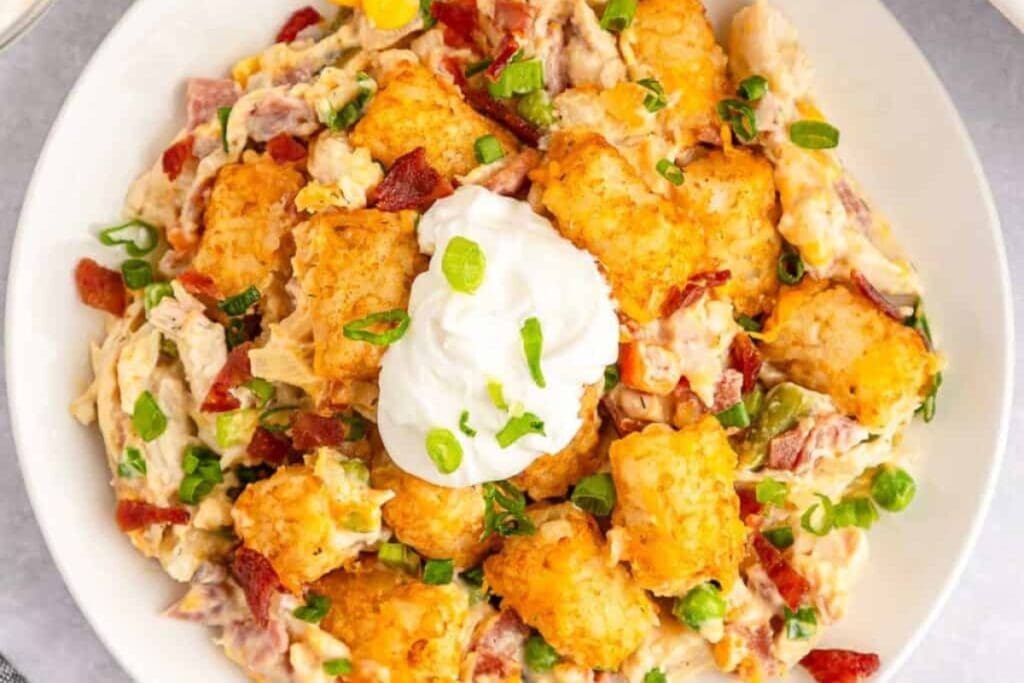 Chicken tater tot casserole on a white plate.