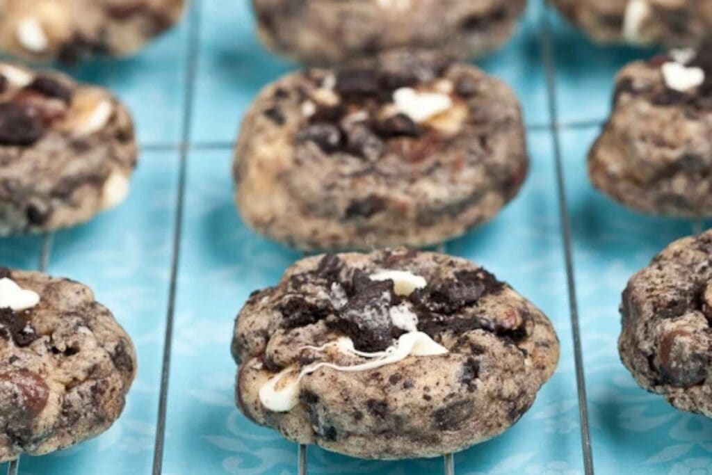 Cookies 'n cream cookies on a cooling rack.