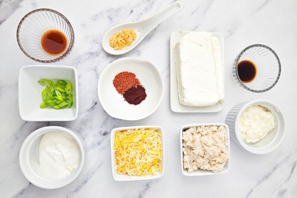 Crab Dip ingredients on a marble table.