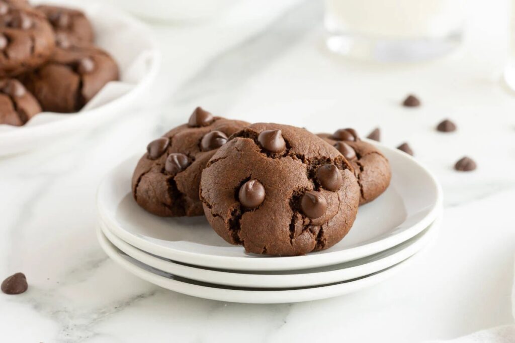Double chocolate cookies on a white plate.