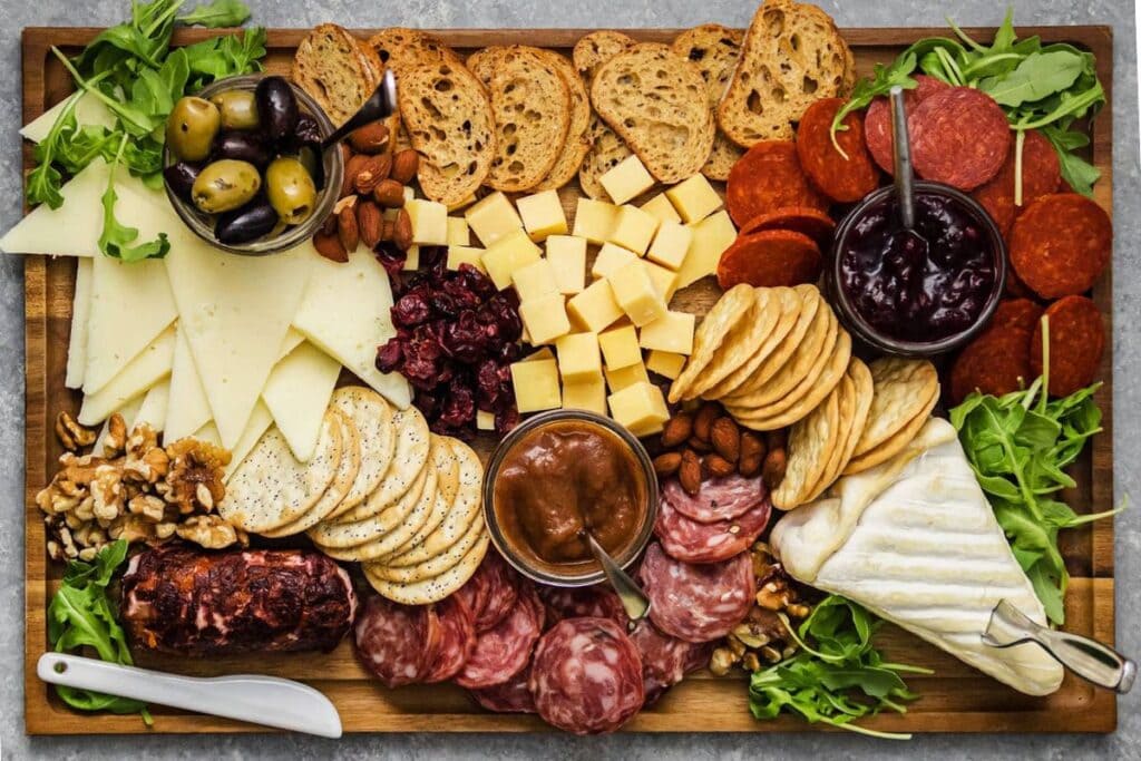 Fall cheese board on a cutting board.
