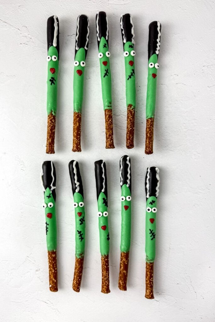 Bride of Frankenstein Halloween pretzel rods on a white surface.
