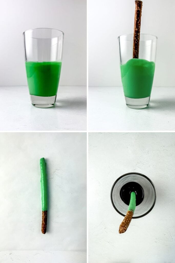 Pretzel sticks dipped in green chocolate and placed on baking sheet