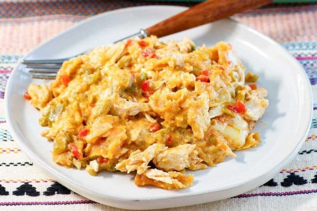 King Ranch casserole on a white plate with a fork.
