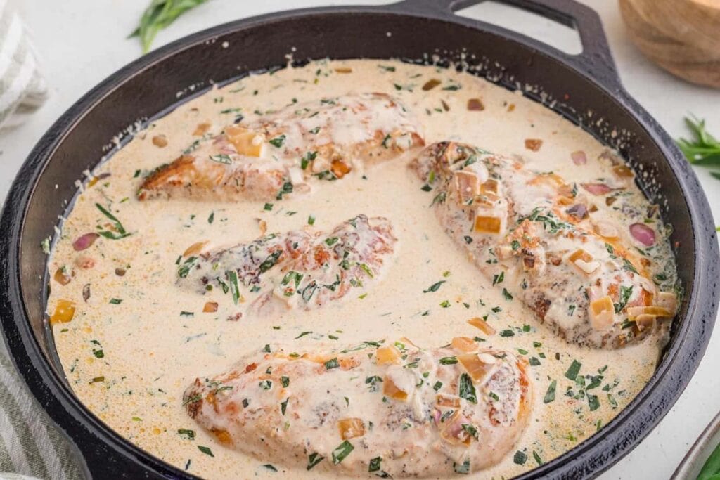 One skillet tarragon chicken with creamy sauce and fresh herbs.