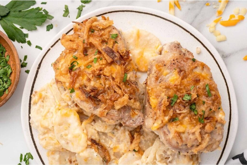 Pork chop casserole served on a white plate.