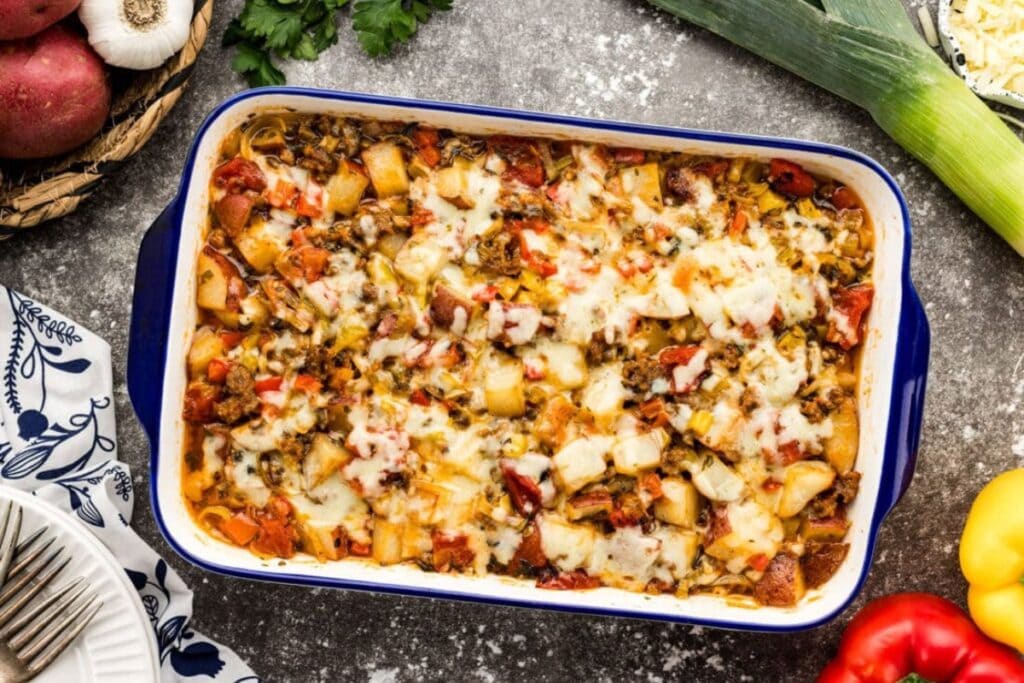 Sausage and potato casserole in a rectangular baking dish.