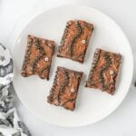 Four spell book brownies on a plate.