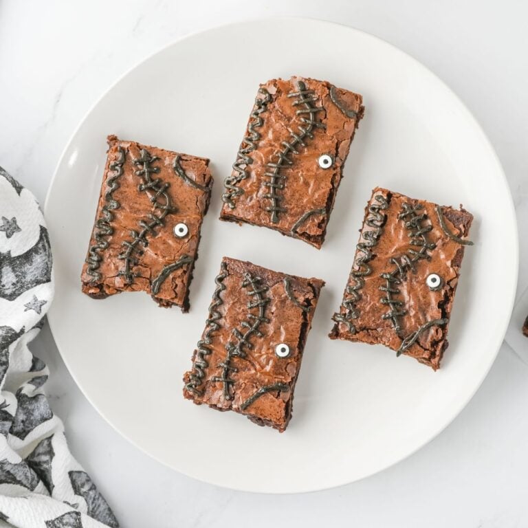 Four spell book brownies on a plate.