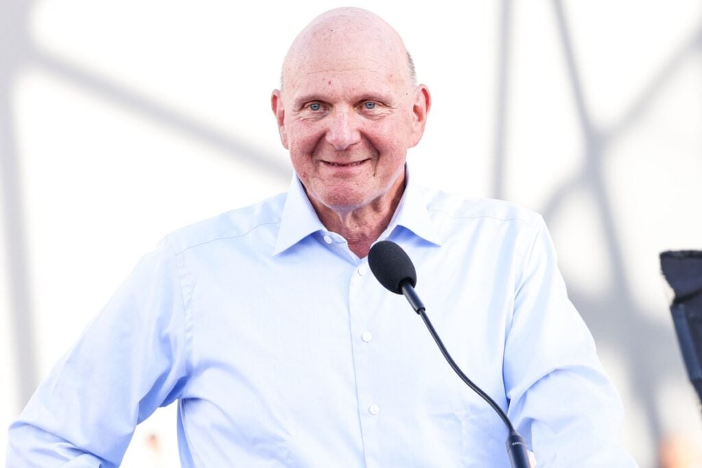 Steve Ballmer on stage with a mic.