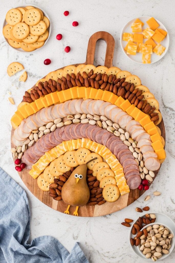 turkey charcuterie board on a white surface.