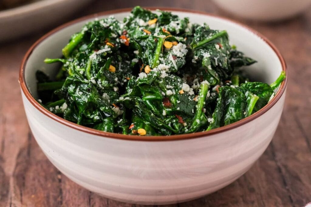 A bowl of spinach.